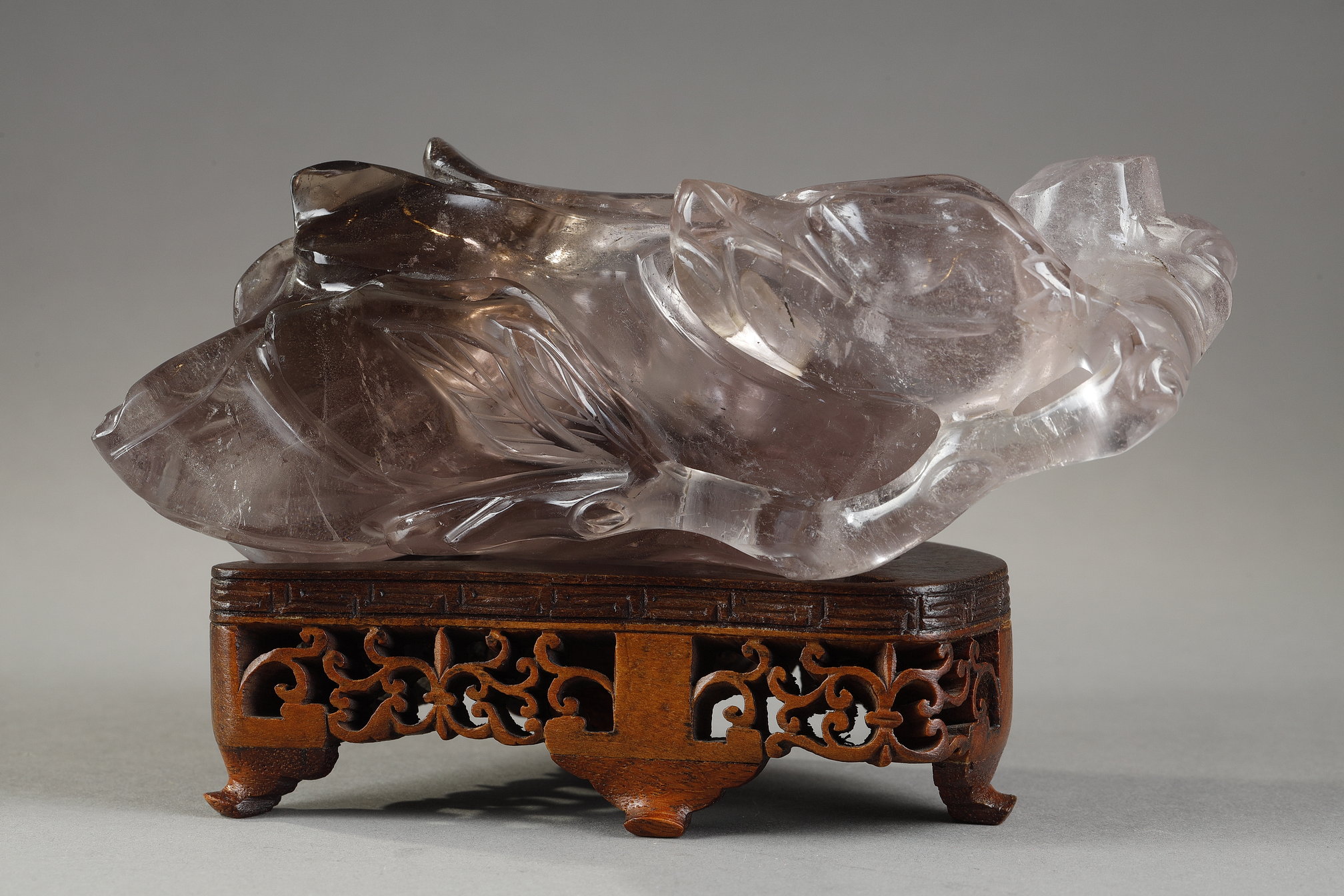 smoked rock crystal box carved in the shape of a branch and foliage holding fruit - China 19th century
Carved wooden base